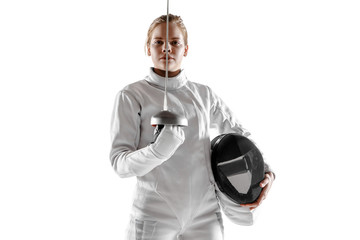 Teen girl in fencing costume with sword in hand isolated on white studio background. Young female...