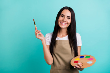 Photo of toothy cheerful beaming cute nice pretty woman looking at you holding colorful palette...