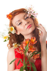 Portrait of beautiful woman with spring flowers on white