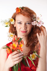 Obraz na płótnie Canvas Portrait of beautiful woman with spring flowers
