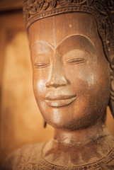 Fototapeta na wymiar closeup of wooden buddhas, woodwork and craftsmanship 