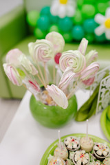 green candies on a white table 