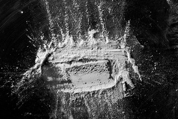 White powder isolated on black background, top view with clipping path
