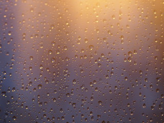 vintage color tone of Water and rain drops on the glass, abstract view, Drops of rain on blue glass background / drops on glass after rain. Image has shallow depth of field.