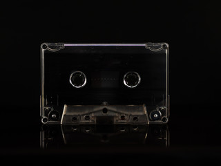 Obraz premium Old audio cassette on a black background. vintage