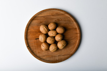 walnuts on wooden utensils. Close up view of walnuts. Walnuts are 4 water, 15 protein, 65 fat and...