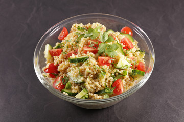 pasta salad with tomato, cucumber and herb