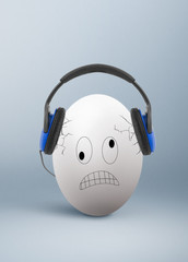 Angry egg with headphones, unbearable, annoying music concept