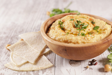 hummus, chickpea dip with spicy, oil and coriander