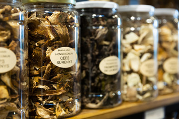 Fototapeta premium Dried mushrooms in jars in grocery