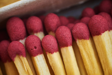 matches in a box with red heads macro photo close-up