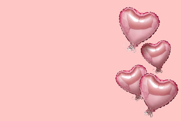 Flying pink air balloon in the shape of a heart on a pink background. Love concept, valentines day....