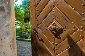 Massive old half-open wooden doors