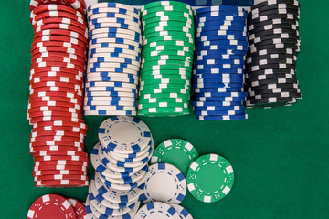 Colorful poker chips in rows close up as background. Gambling concept