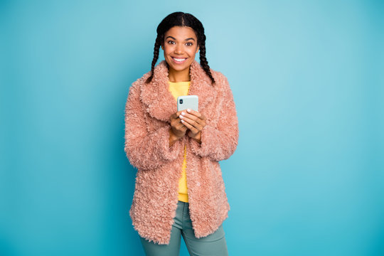 Portrait of her she nice attractive lovely charming trendy fashionable cheerful cheery girl using 5g digital device gadget isolated on bright vivid shine vibrant green blue turquoise color background