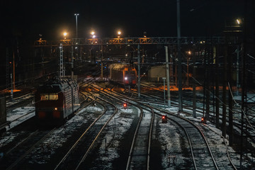 Fototapeta na wymiar Railway. Night landscape of the railway station. Electric locomotives.