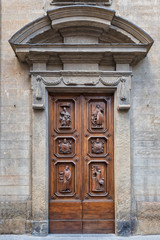 An old decorated vintage door in historical centre of Florence, Italy