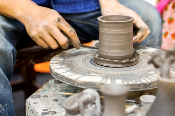 Thailander Demonstration of molding vases with wheel throwing and clay at Chiang Mai, Thailand.