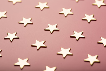 Pinky holiday background with golden stars