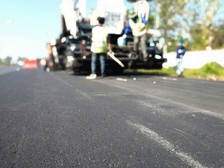 Fototapeta premium Road construction With the method of burning asphalt and mixing additional materials For improved maintenance, blurred images