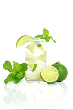 lemonade in Glass via lime pepermint water ice with white background