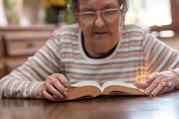 Old woman reading a book