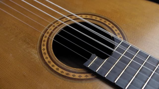Classical Guitar Strings Vibrating when Song is Played Slow Motion