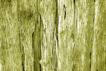 Old grungy wooden wall in yellow tone.