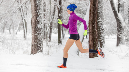 Fototapeta na wymiar girl running in winter snow scenery
