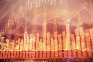 Multi exposure of forex chart drawings over cityscape background. Concept of success.