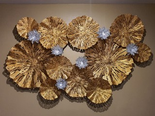 Close-up to art of golden and silver iron flower.