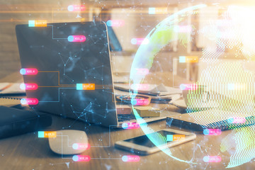 Multi exposure of table with computer and world map hologram. International data network concept.