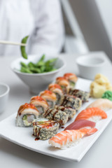 Sushi Roll Set with Seafood on White Plate. Lunch in Japanese Restaurant