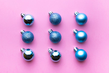 Xmas background. Christmas decoration balls isolated on pink. Abstract winter concept. Flat lay