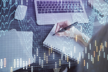 Forex chart displayed on woman's hand taking notes background. Concept of research. Multi exposure