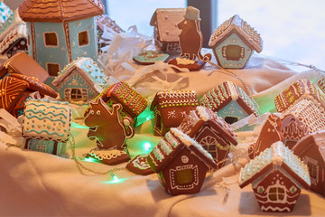 Gingerbread houses and animal figures from dough, pastries and cookies