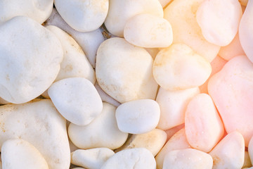 Background in the form of white rocks. Texture of large white stones. Round stone texture.