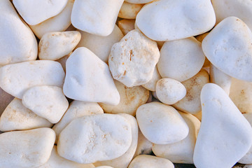 Fototapeta na wymiar Texture in the form of white rocks. Background of large white stones. Round stone texture, close-up.