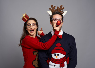 Couple of nerds posing on gray background