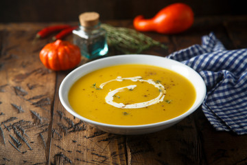 Homemade pumpkin soup with thyme and cream