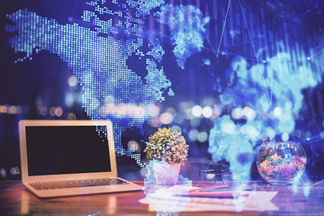 Forex graph hologram on table with computer background. Double exposure. Concept of financial...