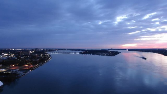 USA Michigan Detroit DJI Mavic flying over Detroit River / Downtown Detroit / Windsor on a dark, cold, winter, morning at Sunrise