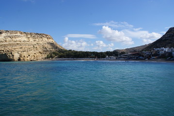 Obraz premium A view of the bay of the southern Cretan village of Matala, which used to be the port of Ancient Phaistos during Minoan and Roman times. Today it is a tranquil sea side resort. 
