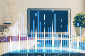 Financial market graph hologram and personal computer on background. Double exposure. Concept of forex.