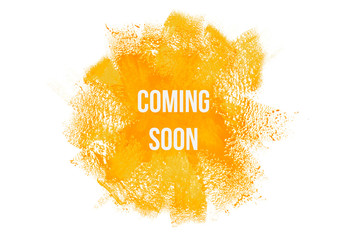 Coming soon on yellow paint background, isolated on white. Advertising banner concept.