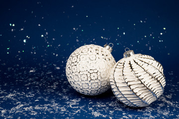 Christmas white balls on a blue background.