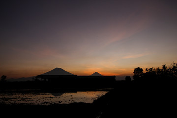 the beauty of the sunset with beauty reflection of mountains in Magelang, Central Java / Indonesia