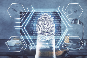 Computer on desktop in office with finger print drawing. Double exposure. Concept of business data security.