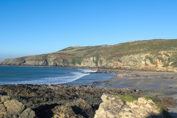 Fototapeta na wymiar Church bay on the island of Anglesey, Wales. A brisk winters day with a clear blue sky. Natural beauty at this unspoiled cove.