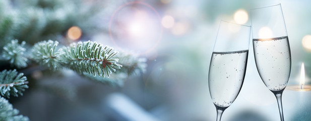 Fir branches in winter and champagne